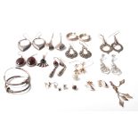 A collection of mixed vintage and 21st Century silver earrings to include a pair of twist design