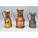 A good collection of three late 19th Century / early 20th century jugs to include a pewter example