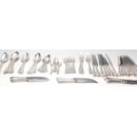 A 20th Century United Cutlery silver cutlery canteen appointed with silver forks, spoons and
