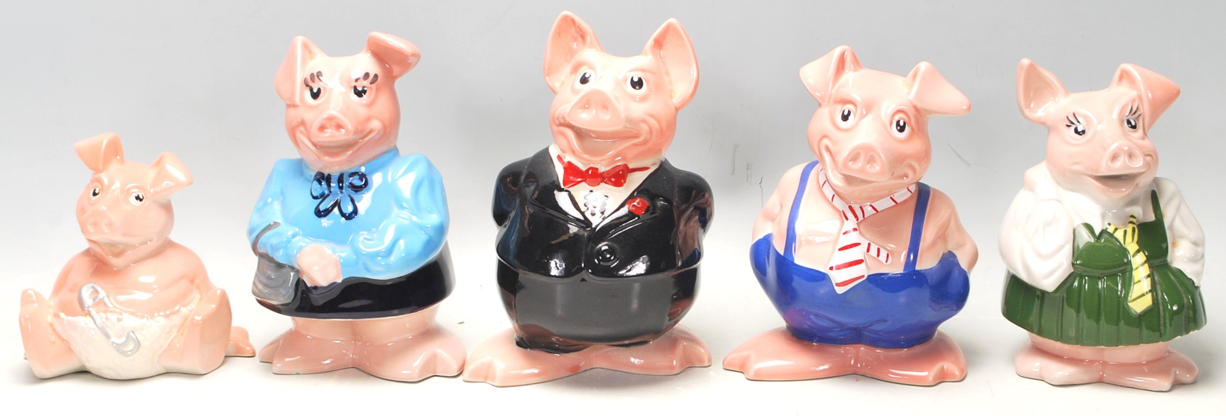 A set of five vintage Wade made NatWest bank advertising / savings / money box pigs. Unboxed, but