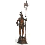An large 20th century cast metal Wellington statue depicting a medieval soldier holding a sword to