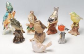 A collection of 20th Century ceramic birds to include Italian bisque examples, a Kingfisher