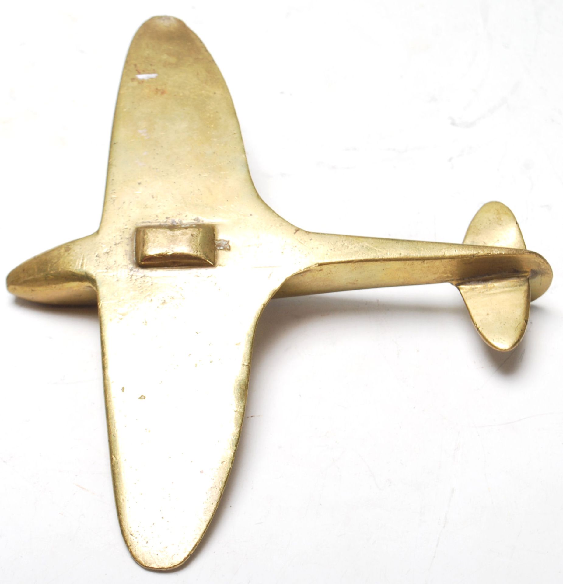 A WWII hand made trench art brass model Spitfire plane. Measures 12.5 x 15cm. Of military interest. - Bild 3 aus 3