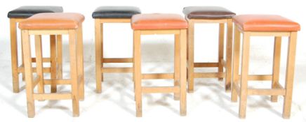 A set of six vintage mid century, circa 1960's retro beech wood kitchen stools with vinyl