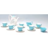 A mid century Midwinter Modern Fashion Shape blue and white coffee set having floral decoration to