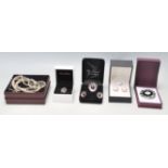 A collection of ladies jewellery to include a silver ring and earring set all being set with black