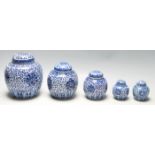 A group of five graduating 20th Century Chinese blue and white ginger jars all being transfer