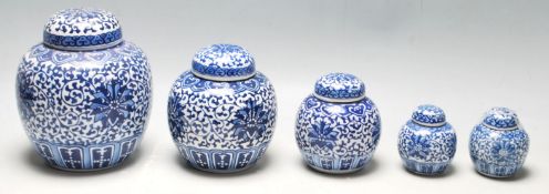 A group of five graduating 20th Century Chinese blue and white ginger jars all being transfer