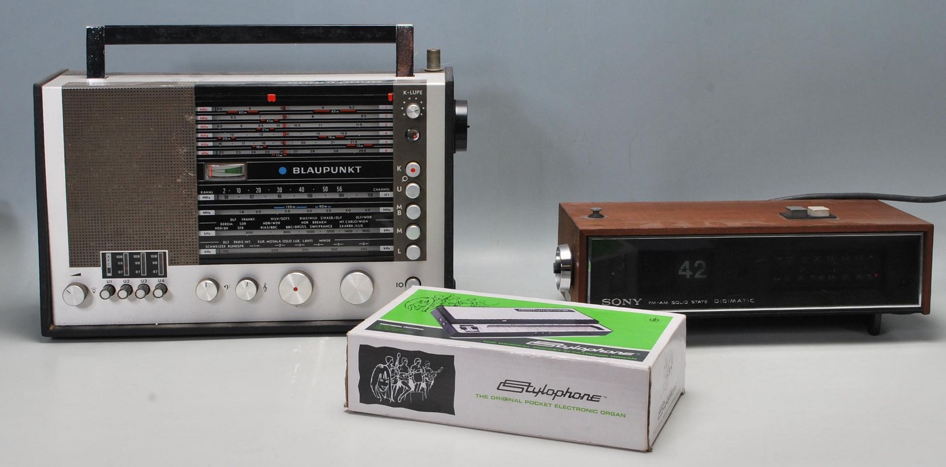 A mixed group of music of music players to include a Blaupunkt Supernova portable radio, a boxed