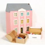 A vintage scratch built three storey toy dolls / doll's house. Each room fully appointed with