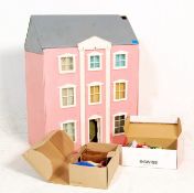 A vintage scratch built three storey toy dolls / doll's house. Each room fully appointed with