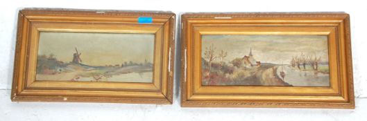 A pair of early 20th Century oil on canvas landscape paintings to include a Netherlands country