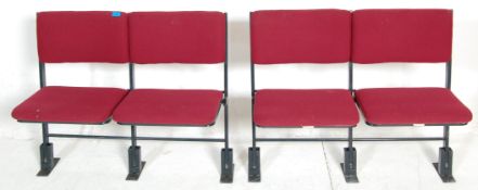 A pair of retro 20th century cinema seats comprisi