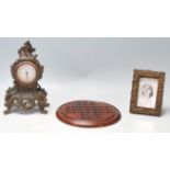 A collection of 20th century antique items to include a french cast iron mantel clock with windup