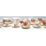 Two vintage English china tea sets to include eight Victorian tea cup trios, creamer jug and creamer