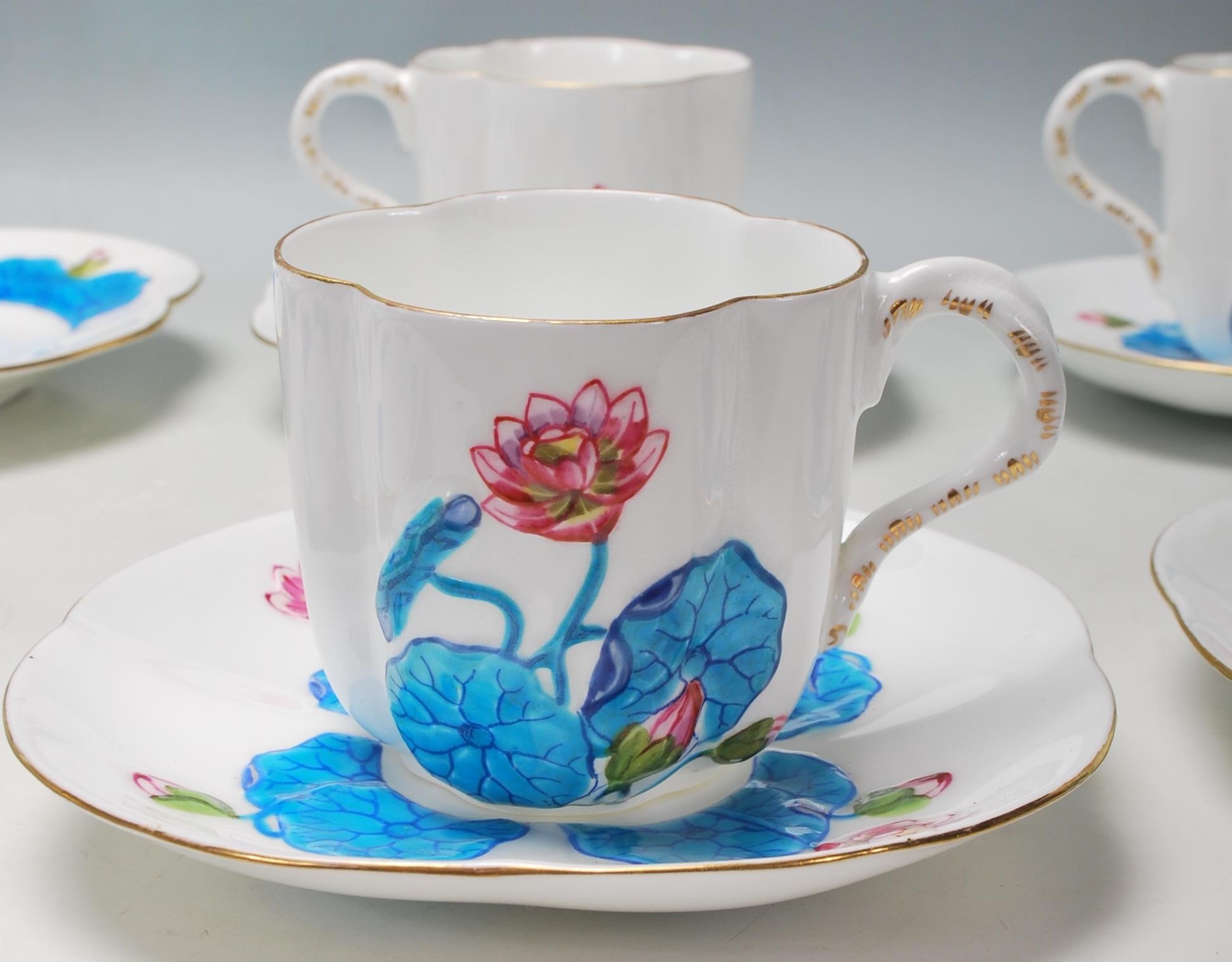 A 19th Century Victorian Coalport china tea set comprising of four trios and one cake plate with - Image 2 of 7