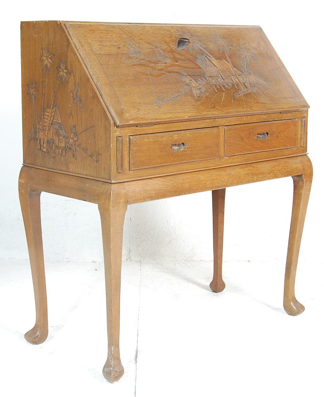 A 20th Century, circa 1950's vintage retro oriental hardwood writing desk bureau having a sloped