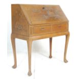 A 20th Century, circa 1950's vintage retro oriental hardwood writing desk bureau having a sloped