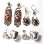 A selection of silver antique earrings to include a pair of Art Deco drop earrings having red