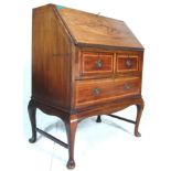 An Edwardian mahogany inlaid fall front bureau writing desk. The bureau with a fall front desk