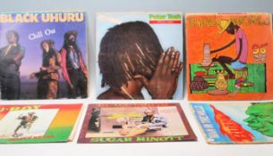 A group of reggae vinyl long LP record albums to include Steel Pulse True Democracy, Bob Marley &