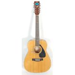 A vintage Yamaha FG 410 12A twelve string acoustic guitar instrument having the Yamaha stamp to