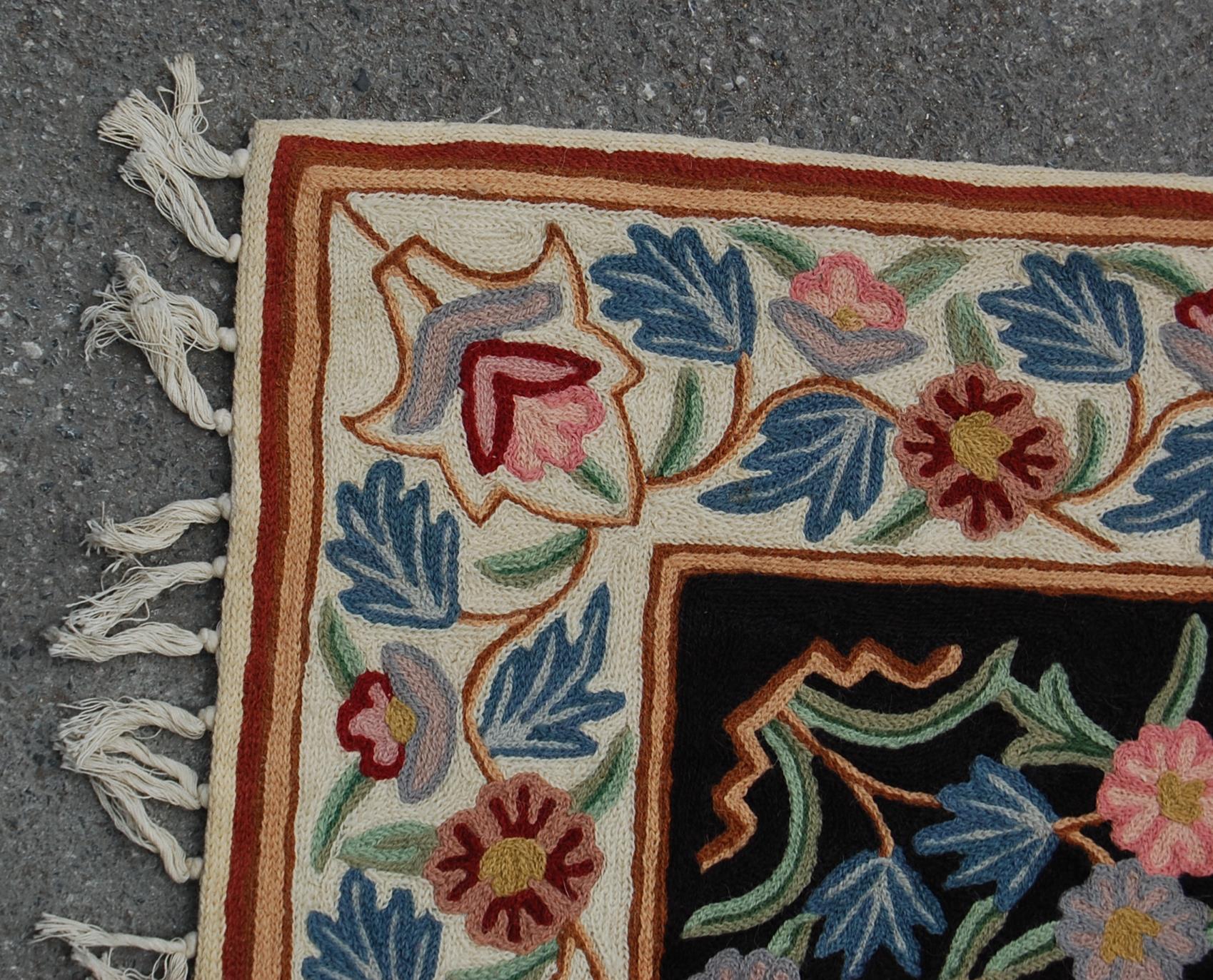 A 20th Century crewel work embroidery wall hanging having a floral bordered design around a - Image 4 of 5