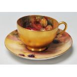 A Royal Worcester porcelain hand painted cup and saucer one decorated with peaches and