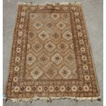 A 20th Century Persian / Islamic rug in brown, white and black featuring repeating geometric