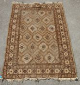 A 20th Century Persian / Islamic rug in brown, white and black featuring repeating geometric