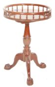 A Victorian 19th Century mahogany style wine table having a spindle gallery top above a turned