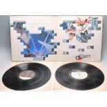 A vinyl long play LP record album by Pink Floyd – The Wall – Later US Press –  PC36183 Stereo. Vinyl