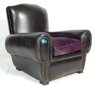 A good early 20th century black leather French club  / Chesterfield armchair. The chair having black