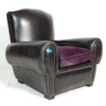 A good early 20th century black leather French club  / Chesterfield armchair. The chair having black