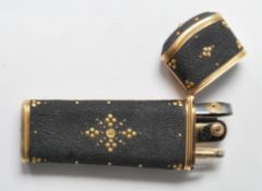 An Etui vanity case having a gilt borders and pique work decoration with a hinged lid opening to