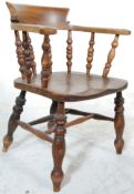 An antique 19th Century Victorian beech and elm smokers bow chair / armchair having a spindle back