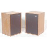 A pair of vintage 1960’s teak wood case wharfedale speakers, having brown fabric protection and wire