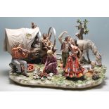 A very large 20th century Capodimonte centrepiece figurine group 'The Gypsy Encampment by Sandro