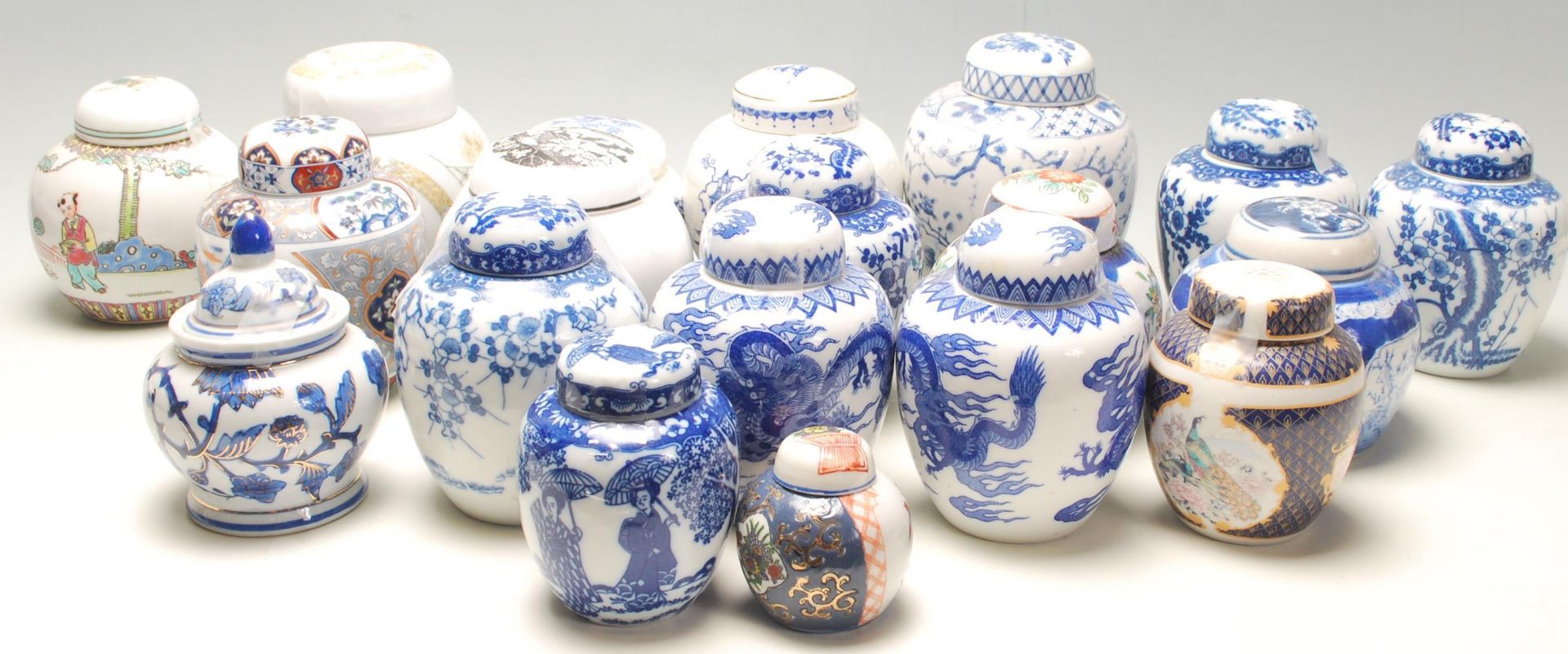 A collection of fifteen 20th Century Chinese blue and white printed ginger jars to include a good