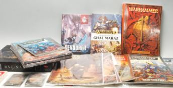 A large collection of Games Workshop / Citadel Warhammer war gaming books to include: rules book,