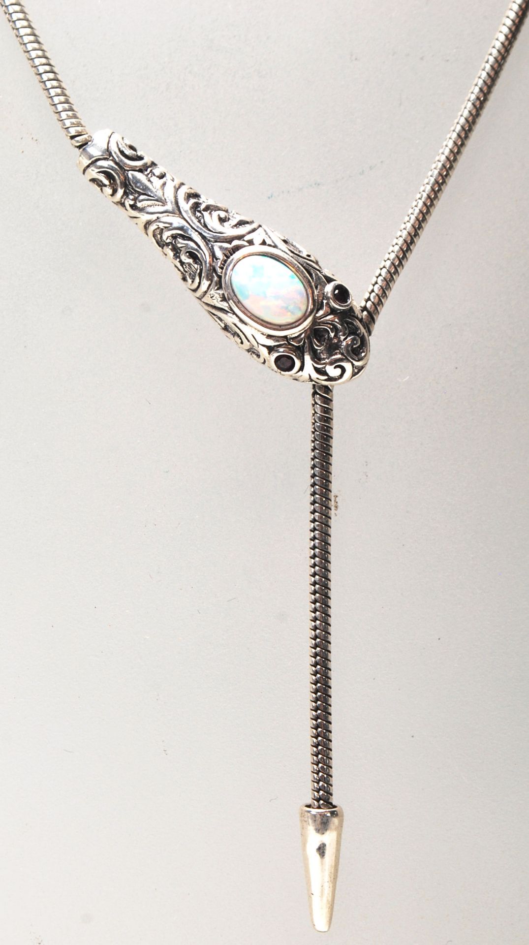 A white metal and opal ladies necklace in the form of a snake having floral swags to the head and - Bild 3 aus 6