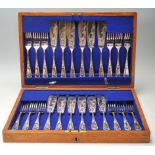 A 19th century Victorian William Hutton & sons silver plated canteen of cutlery comprising of twelve