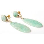 A pair of 9ct gold and jade screw back drop earrings having tear shaped drops carved with florals