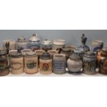 A large collection of German blue and grey stoneware jugs and beer steins, some having pewter