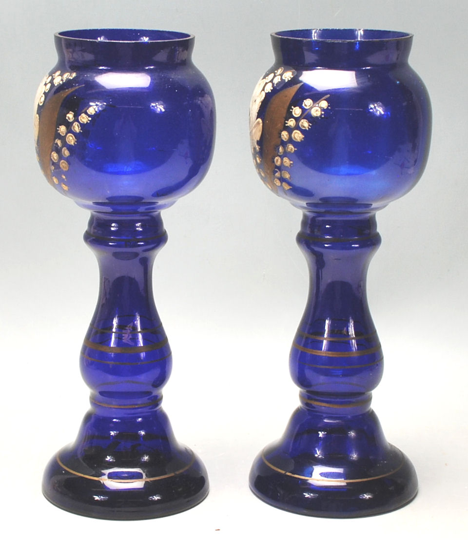 A pair of early 20th Century Bristol Blue vases hand painted with flowers and gilded detailing. - Image 4 of 6