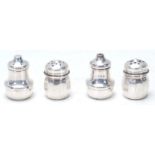 Two pairs of 20th Century silver hallmarked table cruets to include a salt and pepper shaker of