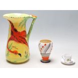 An Art Deco Burleigh Ware large water jug with a raised hand painted flamingo to the side and with a