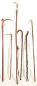 A collection of mixed 20th Century walking stick canes to include four walking sticks with horn