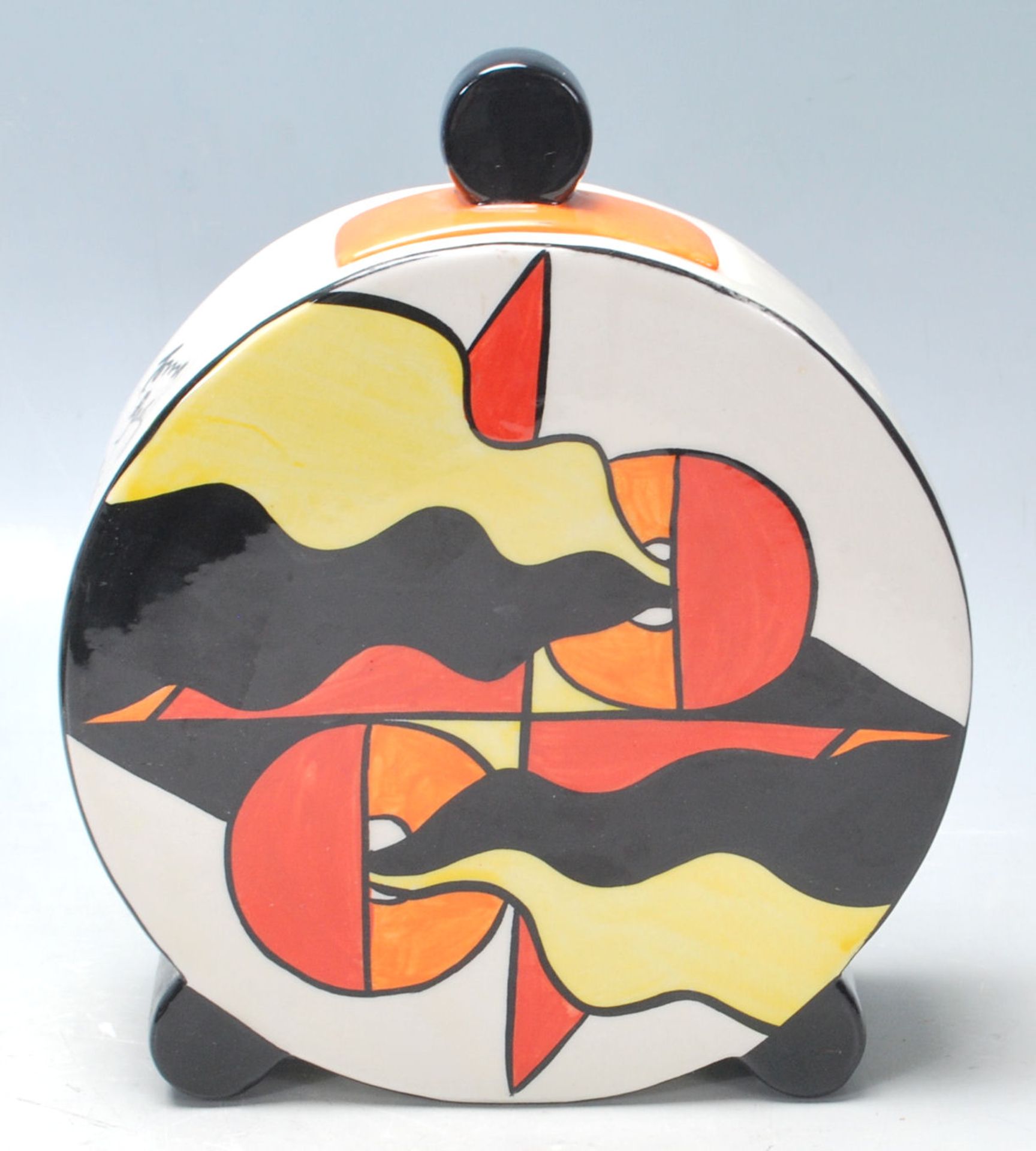 Lorna Bailey ceramic charger plate being hand painted with black, blue, yellow and orange colours, - Image 4 of 6