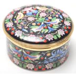 A vintage Halcyon Days Enamels musical box has decoration after “ The Strawberry Thief “ by